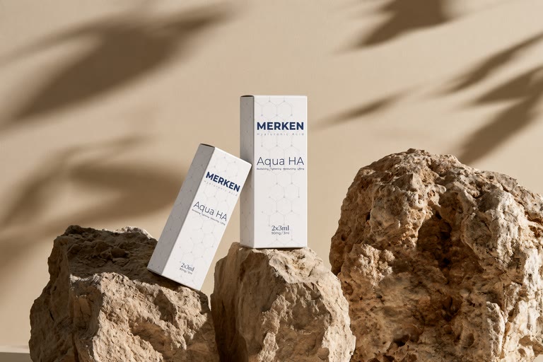 MERKEN Aqua HA packaging arranged on stone